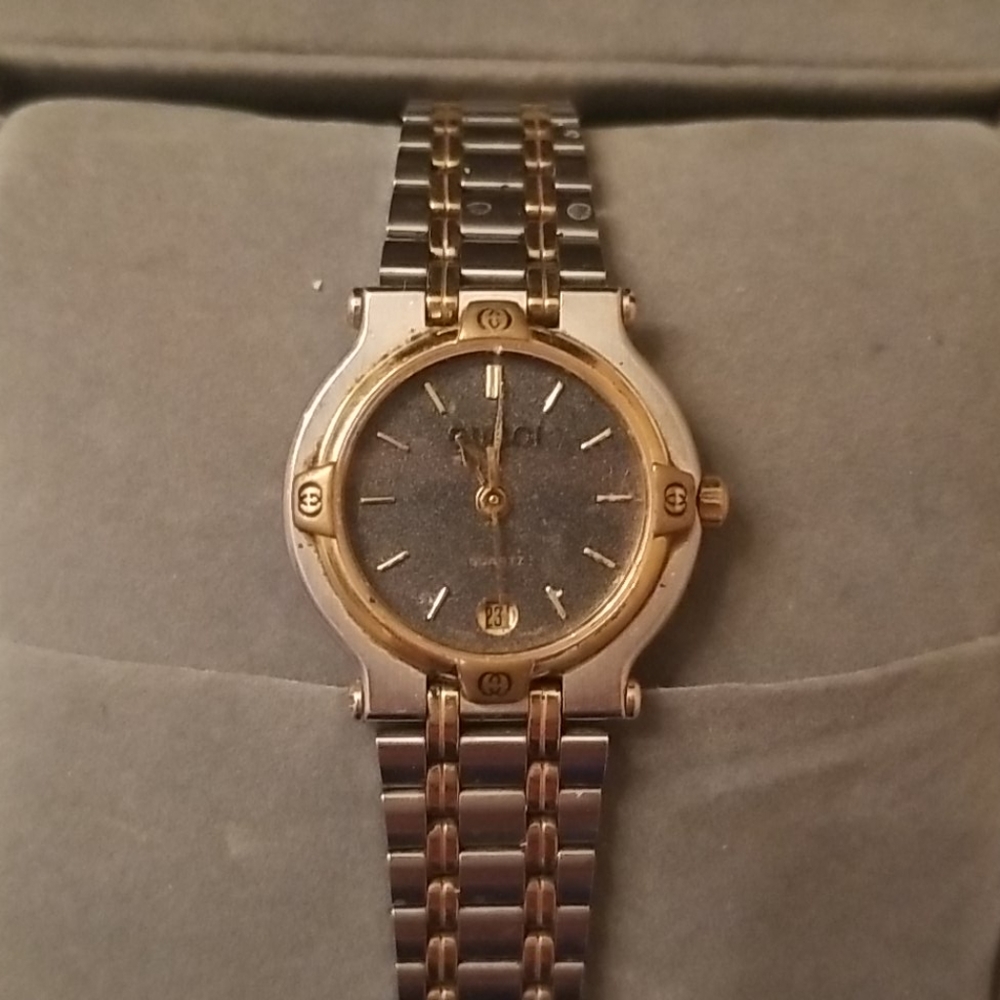 Ladies vintage gold and stainless steel Gucci watch.